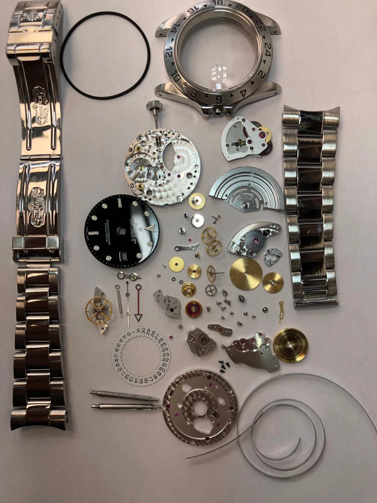TimeRepair watch repair specialist inspecting a timepiece with precision tools